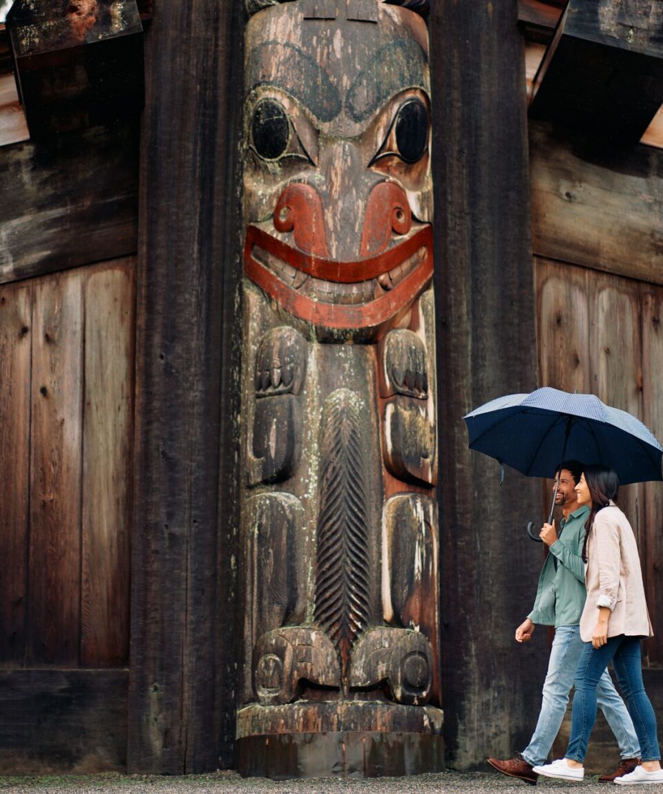 A couple is exploring the Museum of Anthropology in Vancouver