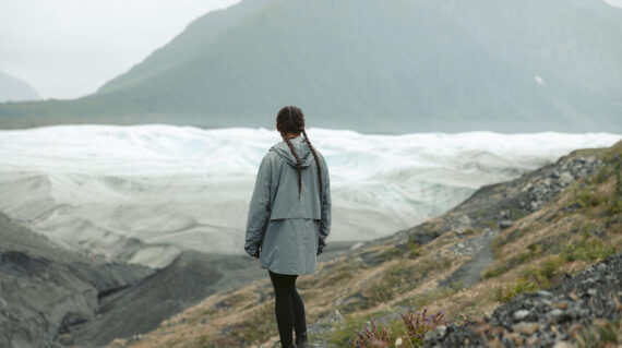 Woman looking toward glacier